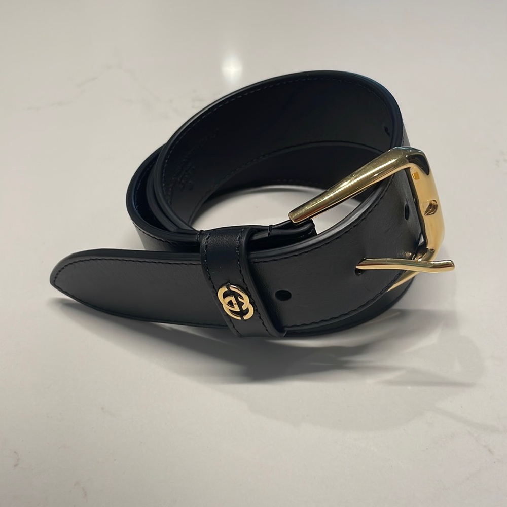 Gucci Men’s size 95 black belt with gold buckle.